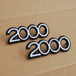 Datsun Roadster "2000" Side Fender Emblems Set *NOS*