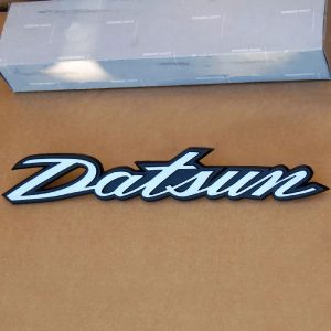 Datsun 240Z Hatch/Deck Lid Emblem "Datsun" 1970-1973 NOS OEM